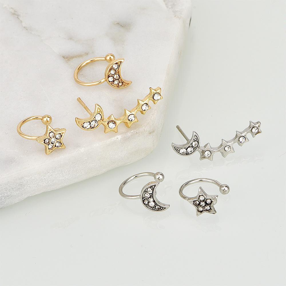 Conjunto de pendientes y brazaletes con forma de luna y estrella